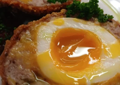 The Beehive delicious fresh cooked scotch eggs with a jammy centre, bacon jam and chive oil